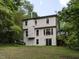 Two-story home with vinyl siding and a walkout basement at 1514 John Jones Rd, Bahama, NC 27503
