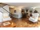 Inviting living room with hardwood floors, comfortable seating, and an open layout leading to the kitchen at 1514 John Jones Rd, Bahama, NC 27503