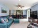 Spacious living room features plush seating, a large TV, and natural light at 1514 John Jones Rd, Bahama, NC 27503