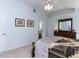 Peaceful main bedroom featuring a quilt-covered bed, soft carpet, and a spacious layout at 1514 John Jones Rd, Bahama, NC 27503
