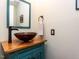 Stylish powder room featuring a vessel sink, wood countertop, and modern fixtures for a contemporary look at 1514 John Jones Rd, Bahama, NC 27503