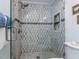 Elegant shower with mosaic tile, glass door, and built-in shelving at 1514 John Jones Rd, Bahama, NC 27503