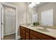 Bathroom featuring double vanity sinks and shower with curtain at 1540 Sandybrook Ln, Wake Forest, NC 27587