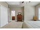 Bright bedroom with a view into the ensuite bathroom at 1540 Sandybrook Ln, Wake Forest, NC 27587