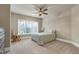Cozy bedroom featuring a ceiling fan and a window with natural light at 1540 Sandybrook Ln, Wake Forest, NC 27587