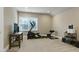 Bright exercise room featuring an elliptical machine, free weights and a wall-mounted television at 1540 Sandybrook Ln, Wake Forest, NC 27587