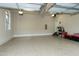 Spacious garage with epoxy floor, storage and access door at 1540 Sandybrook Ln, Wake Forest, NC 27587