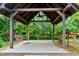 Cozy gazebo with a swing and ceiling fan, creating a relaxing outdoor retreat at 1540 Sandybrook Ln, Wake Forest, NC 27587