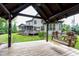 Relaxing view from inside the gazebo towards the main house and backyard, perfect for entertaining at 1540 Sandybrook Ln, Wake Forest, NC 27587