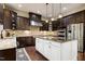 Kitchen featuring dark wood cabinets, stainless steel appliances, and a kitchen island at 1540 Sandybrook Ln, Wake Forest, NC 27587