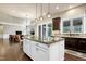 Island in kitchen area features granite countertops and connects to the home's living room at 1540 Sandybrook Ln, Wake Forest, NC 27587