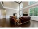 Bright living room boasts a fireplace, hardwood floors, and plenty of natural light at 1540 Sandybrook Ln, Wake Forest, NC 27587