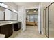 An ensuite bathroom with tile floors, a vanity and a glass enclosed shower at 1540 Sandybrook Ln, Wake Forest, NC 27587