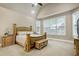 Spacious main bedroom featuring a vaulted ceiling, large windows and neutral decor at 1540 Sandybrook Ln, Wake Forest, NC 27587