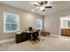 Spacious home office featuring two windows, a printer and a built-in desk at 1540 Sandybrook Ln, Wake Forest, NC 27587