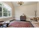 Bright office space featuring a vaulted ceiling, a large window, hardwood floors, and classic neutral walls at 1540 Sandybrook Ln, Wake Forest, NC 27587