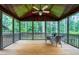 Screened porch with wooded view and furnishings; a quiet space to enjoy the outdoors at 1540 Sandybrook Ln, Wake Forest, NC 27587