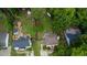 Aerial view of a home showcasing a well-landscaped yard, patio, and proximity to neighboring houses at 1605 Hall Blvd, Garner, NC 27529