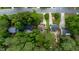Overhead view of a home with a well-maintained yard, deck, and patio in a suburban neighborhood at 1605 Hall Blvd, Garner, NC 27529