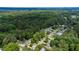 Aerial view of a neighborhood showcasing lush greenery and well-maintained homes on a sunny day at 1605 Hall Blvd, Garner, NC 27529