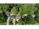 Aerial view of a neighborhood with houses surrounded by mature trees and greenery at 1605 Hall Blvd, Garner, NC 27529
