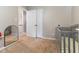 Neutral bedroom with closet and baby crib at 1605 Hall Blvd, Garner, NC 27529