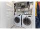 Convenient laundry room features side-by-side washer and dryer and ample storage space at 1605 Hall Blvd, Garner, NC 27529