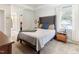 Comfortable main bedroom featuring a large bed, window, and en-suite bathroom access at 1605 Hall Blvd, Garner, NC 27529