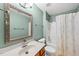 The bathroom is equipped with a sink and shower, offering functionality and comfort at 1605 Old London Way, Apex, NC 27523