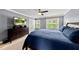 Inviting bedroom with plush carpeting, a ceiling fan, and a large television mounted on a dresser at 1605 Old London Way, Apex, NC 27523