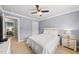 This bedroom boasts soft carpeting and neutral decor, creating a tranquil and inviting retreat at 1605 Old London Way, Apex, NC 27523