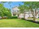 Charming two-story home with a well-manicured lawn and attached two-car garage at 1605 Old London Way, Apex, NC 27523