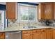 This kitchen boasts stainless steel appliances, a double basin sink, and granite countertops at 1605 Old London Way, Apex, NC 27523
