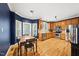 Spacious kitchen with stainless steel appliances, wood cabinets and natural light at 1605 Old London Way, Apex, NC 27523