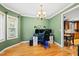 Charming office space with ample natural light, hardwood floors, and crown molding details at 1605 Old London Way, Apex, NC 27523