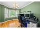Bright office space with hardwood floors, crown molding, and natural light from large windows at 1605 Old London Way, Apex, NC 27523