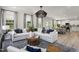 Open-concept living room with lots of natural light, recessed lighting, and stylish decor at 168 Copperleaf Court, Franklinton, NC 27525