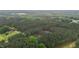 An aerial view revealing secluded homesites surrounded by mature trees and foliage at 1850 Willie Pace Rd, Burlington, NC 27217