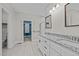 Bright bathroom featuring a double granite vanity, tile flooring, and a large walk-in closet at 1850 Willie Pace Rd, Burlington, NC 27217