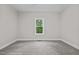 Bright bedroom featuring neutral walls, carpeting, and a window view to outside at 1850 Willie Pace Rd, Burlington, NC 27217