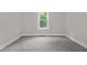 Bedroom with a view to outside, carpeting, and neutral colored walls at 1850 Willie Pace Rd, Burlington, NC 27217