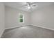 Neutral bedroom with carpet, ceiling fan, and a window providing natural light at 1850 Willie Pace Rd, Burlington, NC 27217