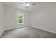 Bedroom with carpeting, neutral walls and a window with natural lighting at 1850 Willie Pace Rd, Burlington, NC 27217