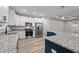 Modern kitchen with white cabinets, granite countertops, stainless steel appliances and eat-in island at 1850 Willie Pace Rd, Burlington, NC 27217