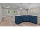 Kitchen island with granite countertops, navy cabinets, and open concept floorplan with lots of windows at 1850 Willie Pace Rd, Burlington, NC 27217