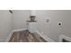 Well-lit laundry room with white cabinets and butcher block countertop at 1850 Willie Pace Rd, Burlington, NC 27217