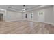 Bright, open living room with modern flooring, a ceiling fan, and neutral paint, offering versatility at 1850 Willie Pace Rd, Burlington, NC 27217