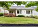 Expansive backyard with a well-maintained lawn, a deck, and tasteful landscaping at 204 Mill Chapel Rd, Chapel Hill, NC 27517