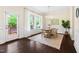 Bright dining room with hardwood floors, wainscoting, natural light, wood table and chairs at 204 Mill Chapel Rd, Chapel Hill, NC 27517