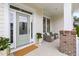 Welcoming front porch with comfortable seating, neutral decor, and a beautiful front door at 204 Mill Chapel Rd, Chapel Hill, NC 27517